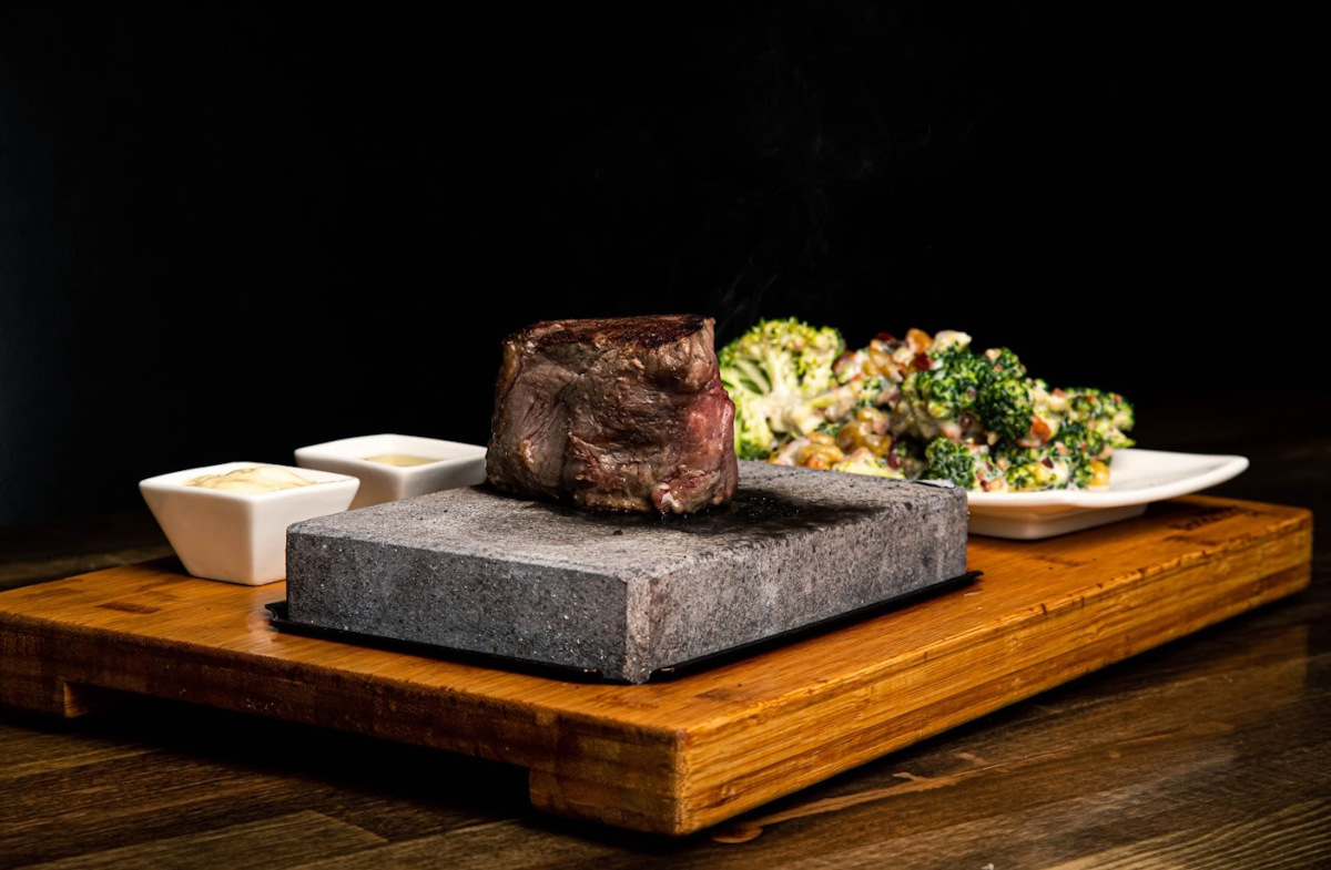 Grilled meat, mixed green salad on the side